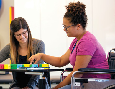 Two Mohawk College Graduate and Professional Studies students working together